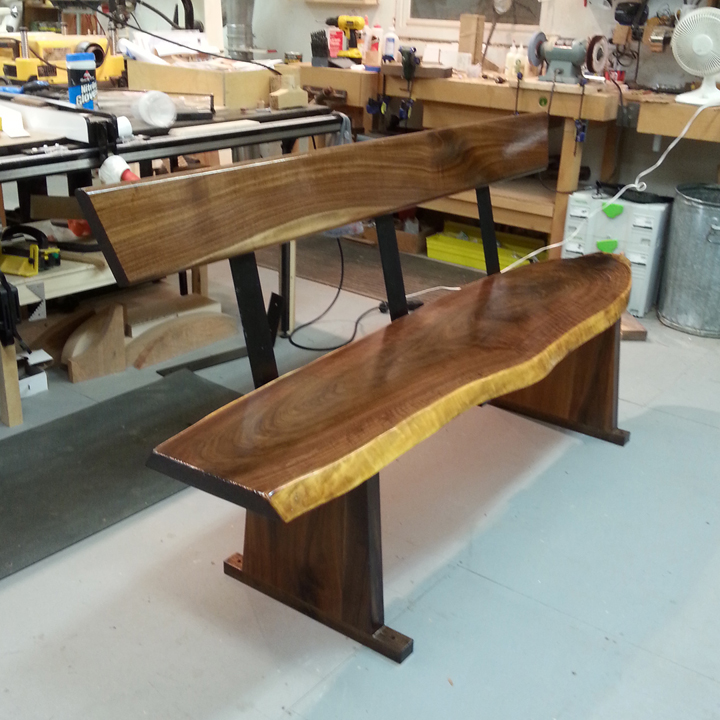 Walnut slab bench installed.